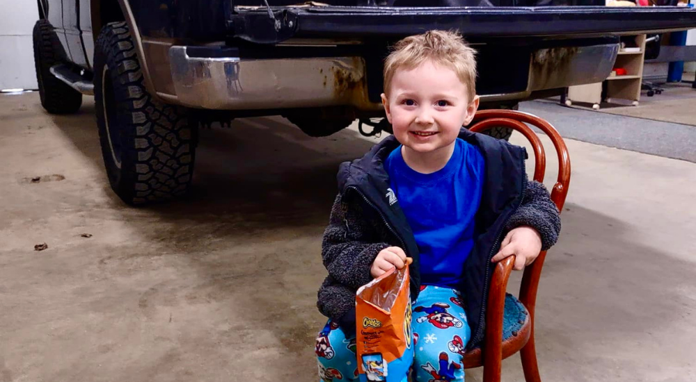 Little Boy Sitting in Chair